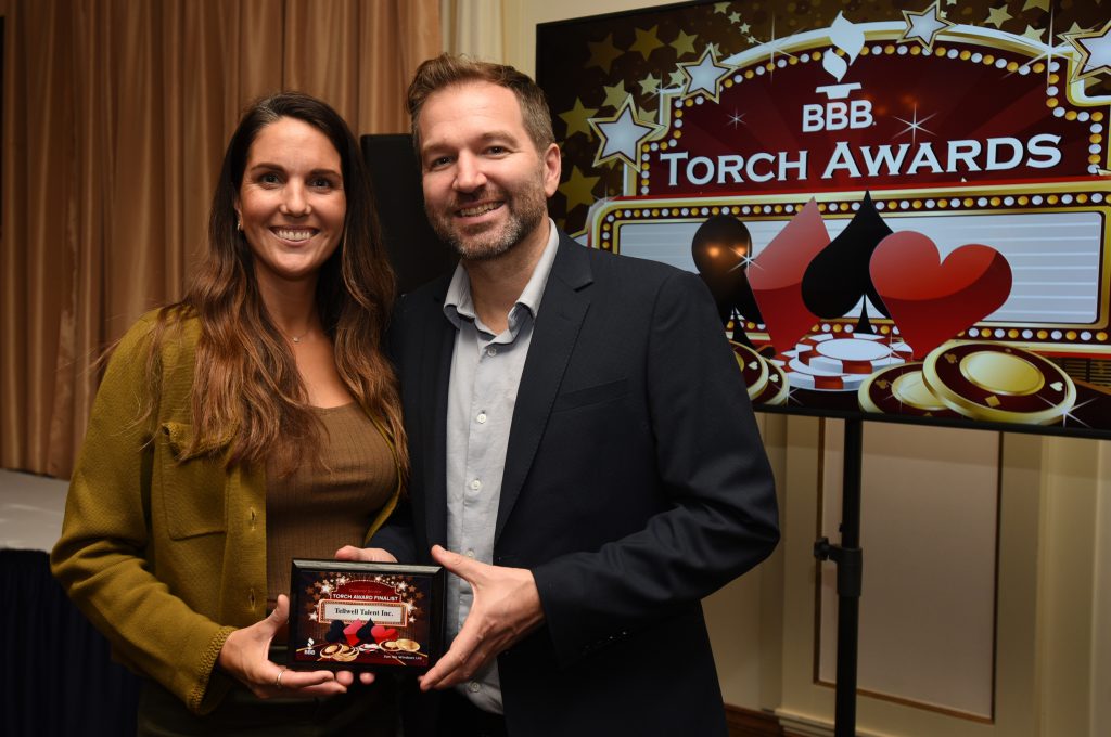 Tellwell Publishing Monica Martinez and Timothy Lindsay Accepting BBB Awards for Ethics